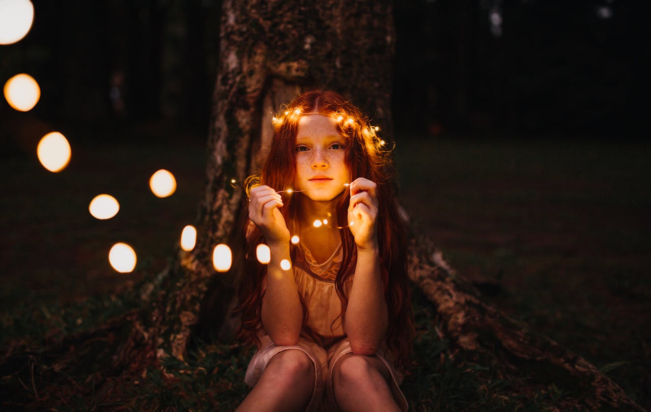Photo by Matheus Bertelli: https://www.pexels.com/photo/girl-holding-string-lights-573298/