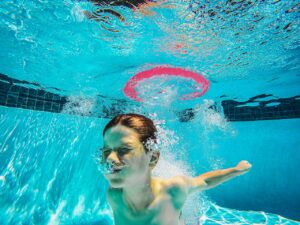 Photo by Kindel Media: https://www.pexels.com/photo/a-boy-in-a-swimming-pool-9044086/